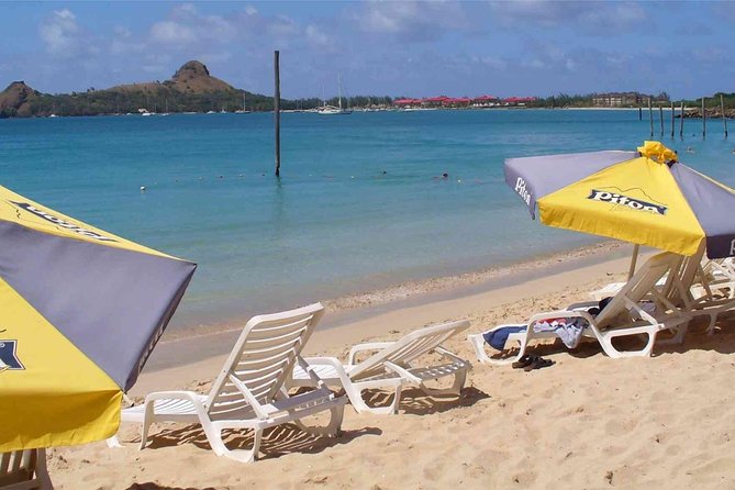 Reduit Beach Round-Trip Shuttle Service - Arriving at Reduit Beach with a drink in hand